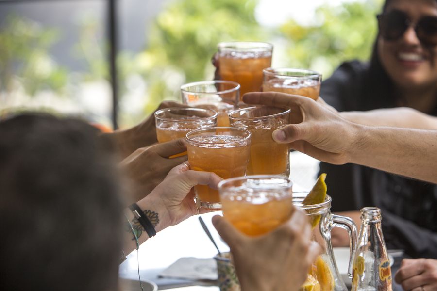 Tour group toasting drinks on the Laureles food tour