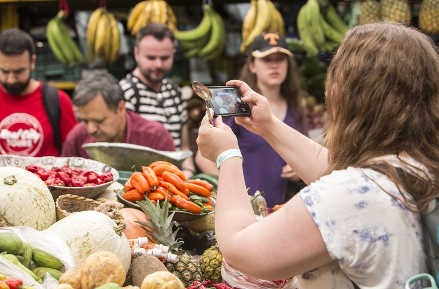 Colorful fruit stalls inside Plaza Minorista market Medellín